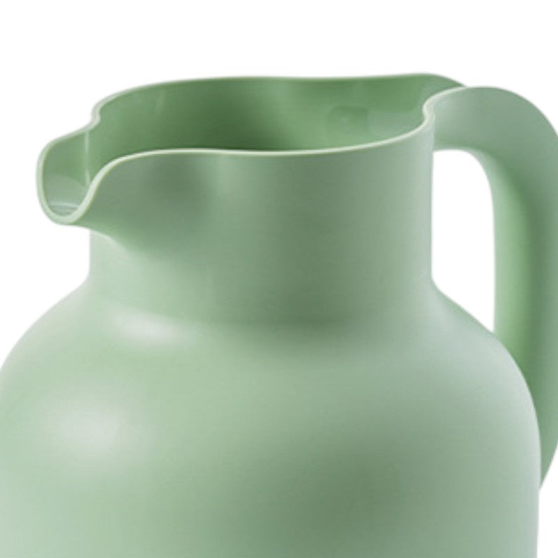 Grüne isolierte Teekanne