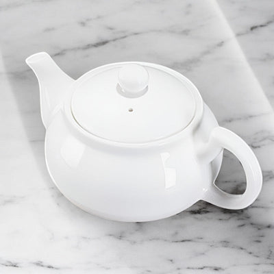 Kleine weiße Teekanne