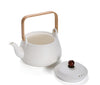 Teekanne mit weißem Rechaud: